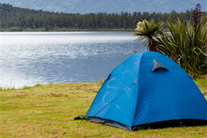 Image of tent next to river