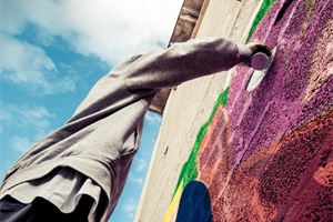 Image of someone doing graffiti