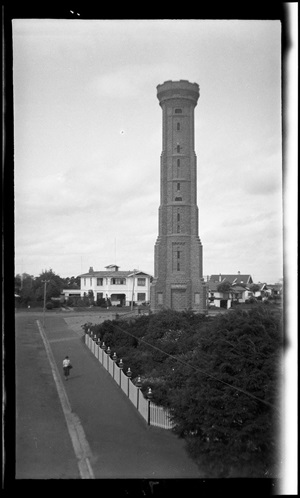 A 1938 photograph by Leslie Adkin of the War Memorial Tower on Durie Hill showing the fence at the historic Duncan hospital - Te Papa