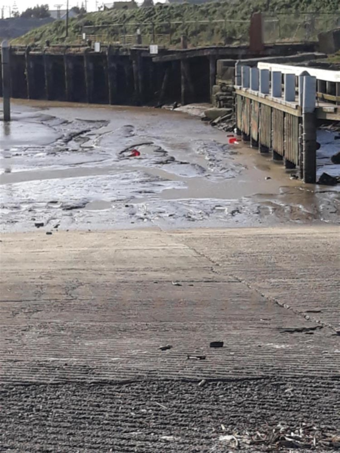 Wharf Street boat ramp low tide with silt 